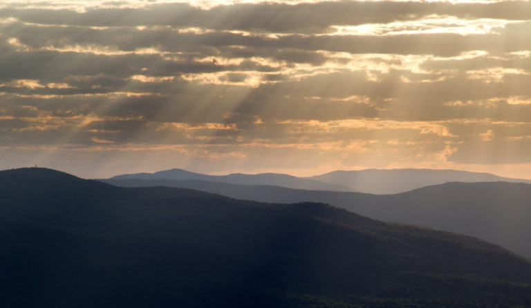 Streaming Sunbeams Over Mountains