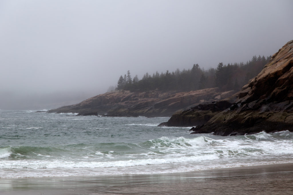 Waves Rolling onto the Beach and Rocky Shore