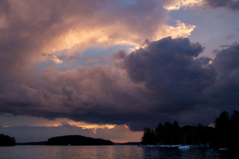 Stormy Sunset Clouds Over Water