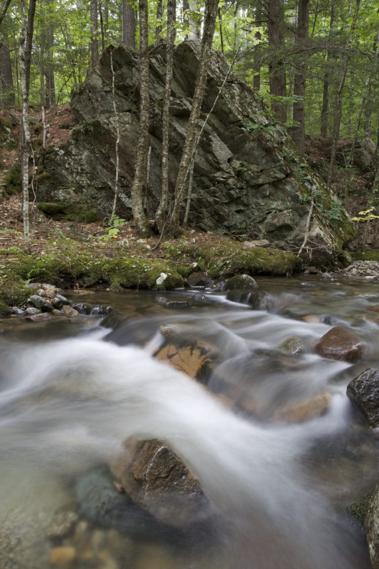 Misty Stream Amongst Large Rocks