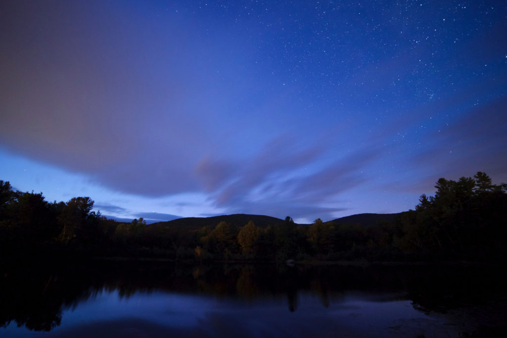 Dark Horizon Under Blue Night Sky