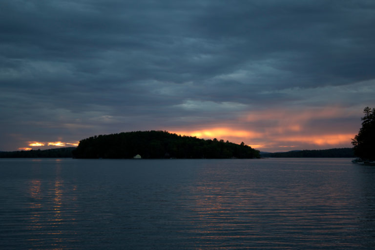 Island Under Cloud Cover at Sunset