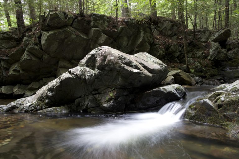 Stream Flowing Past Large Rocks