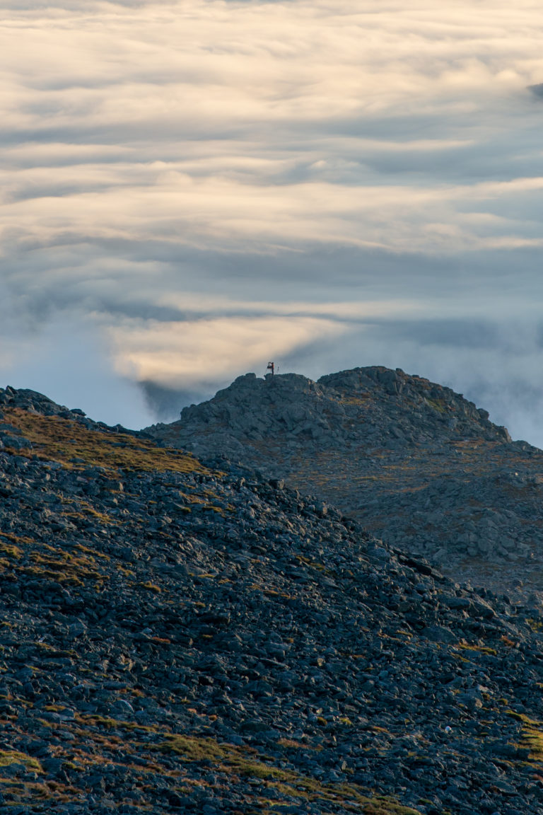 Rolling Clouds Below Rugged Mountains