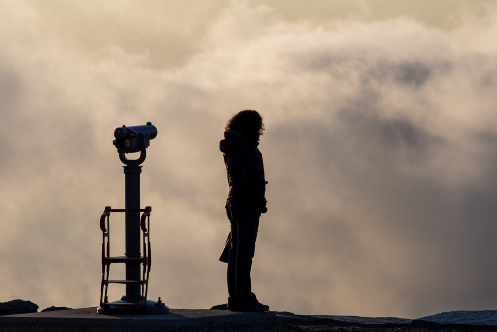 Woman Overlooking Clouds