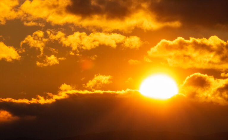 Sun Peeking Through Clouds