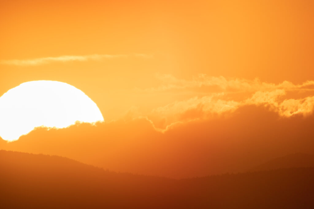 Sunset Over Faint Mountains