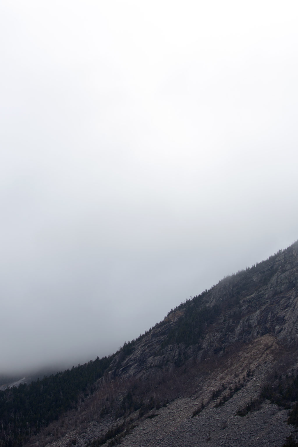 Mountainside Against Thick Fog