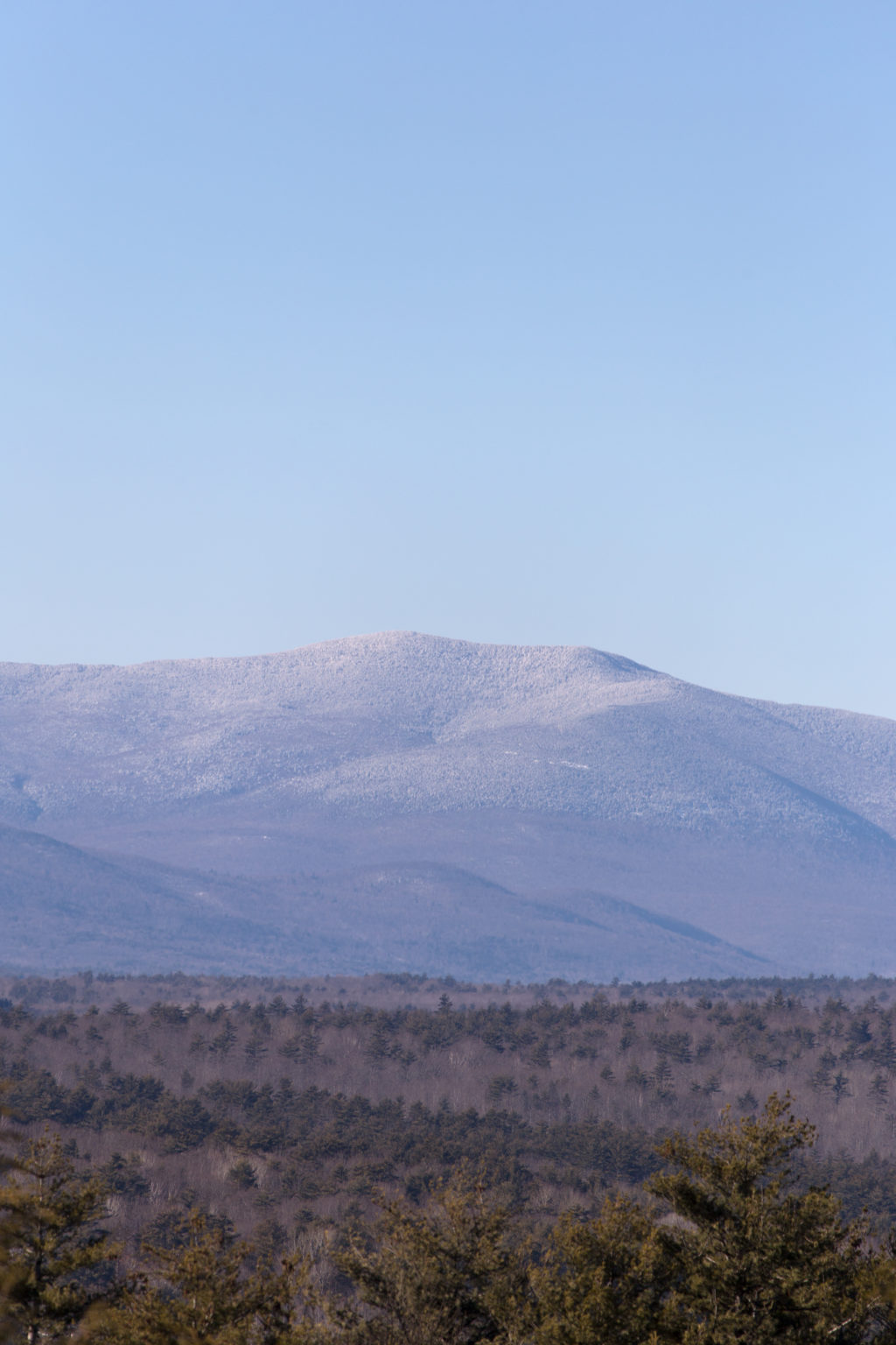 Snow Dusted Mountain Range in the Distance