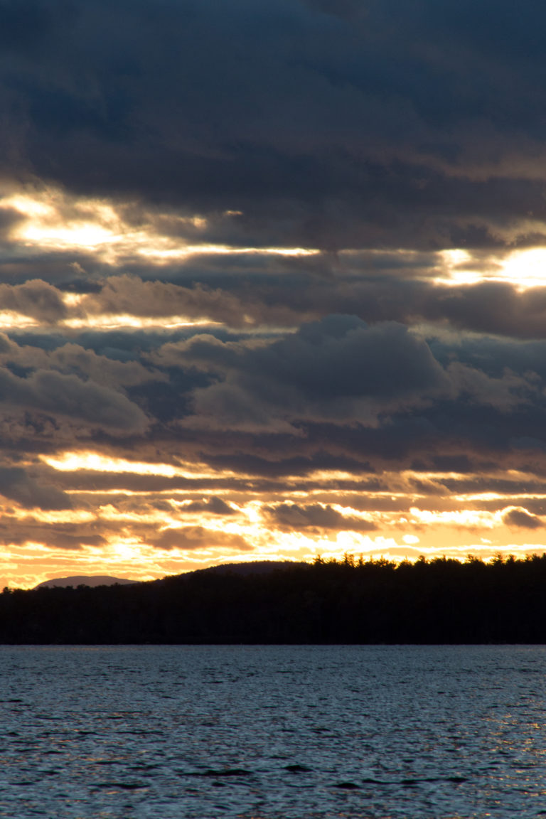 Glowing Light Peeking Through Heavy Clouds