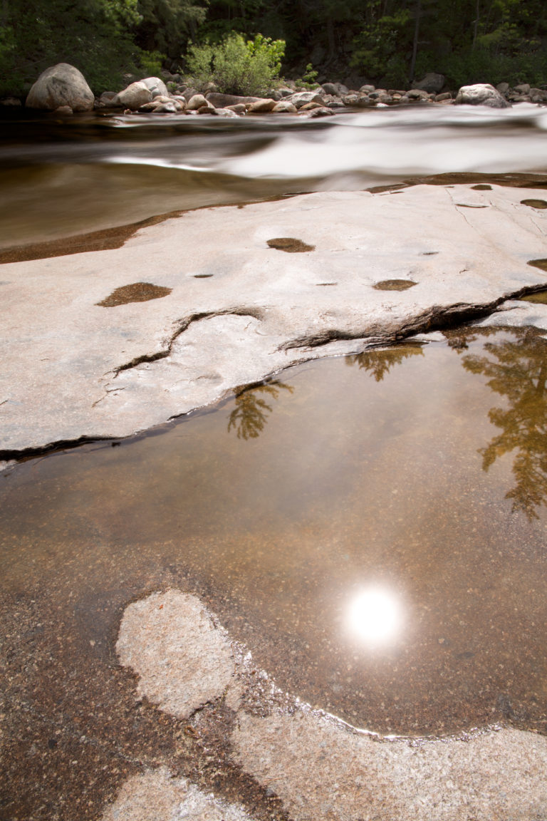 Sun Reflection in Small River Pool