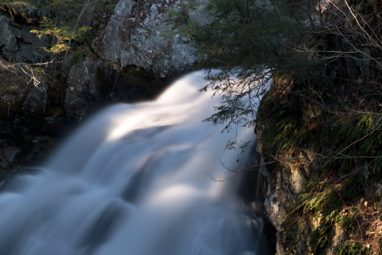 Sunny Glow on Small Rushing Waterfall