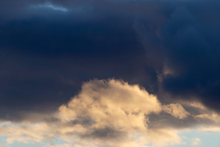 Dark Clouds Over a Bright Cloud