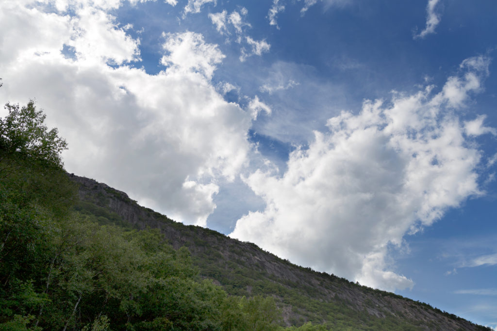 White Clouds and Green Mountain Slope