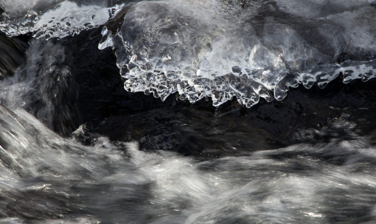 Close-Up of Ice and Rushing Water