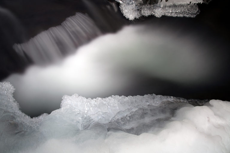 Misty Stream Amongst Icy Snow