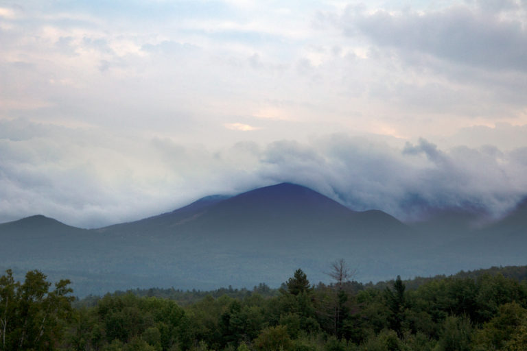 Thick Cloud Cover Rolling Over Mountains