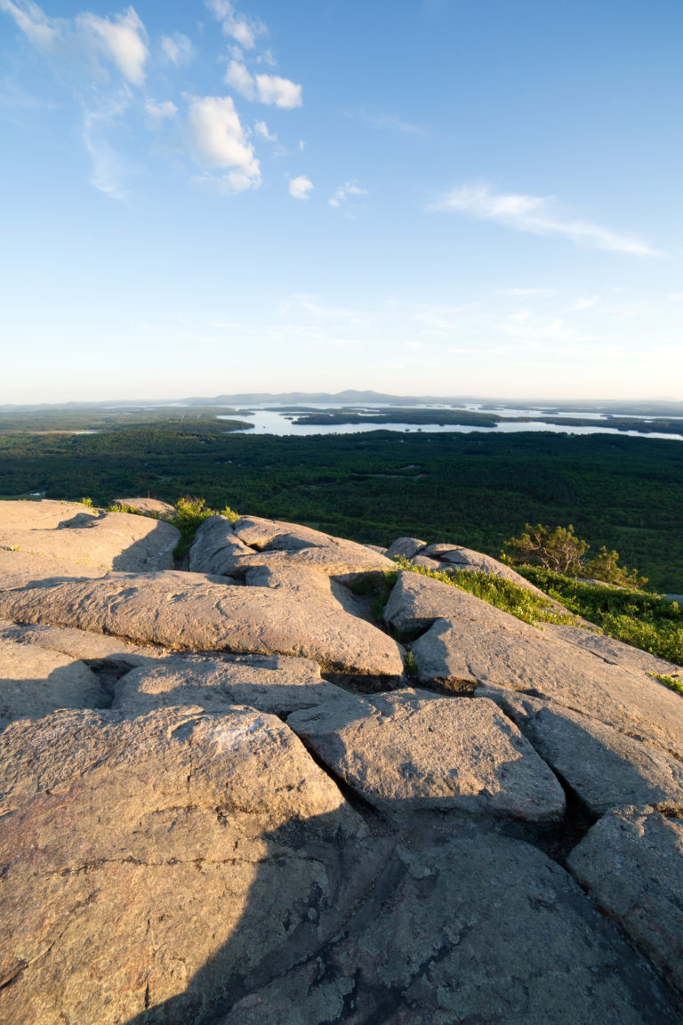 Rocky Lookout with Lakes and Mountains in the Distance